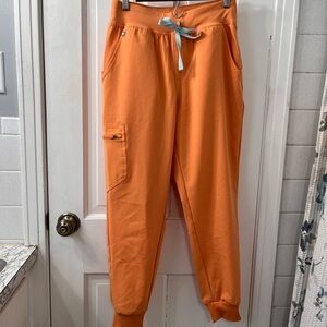 Figs Zamora Jogger Scrub Pants in the Color Shaka Orange